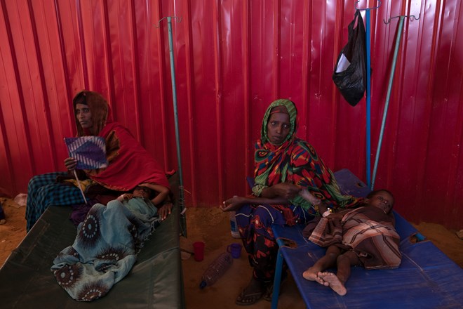 Mothers tended to their children at a cholera treatment center in Baidoa. The decision to relax targeting limits in Somalia comes at a time of famine and drought, with more groups of people moving around and increasing the risk of mistaking civilians as Islamist fighters.